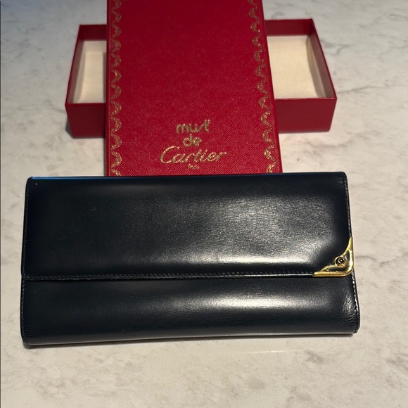 Cartier Handbags - Cartier Black and Gold Leather Clutch